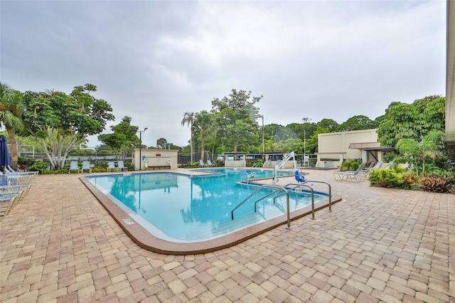 view of swimming pool with a patio area