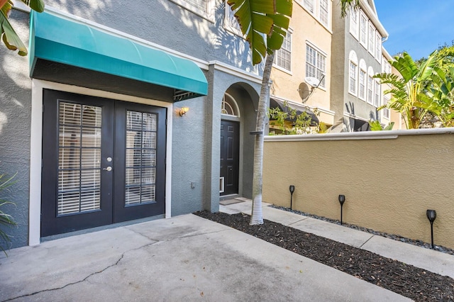 property entrance featuring french doors