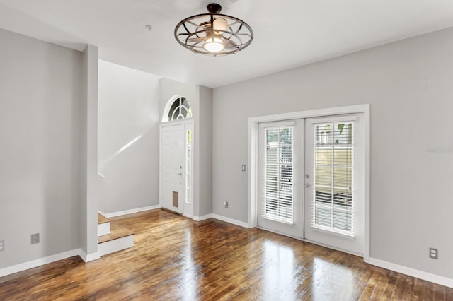 foyer with ceiling fan and hardwood / wood-style floors