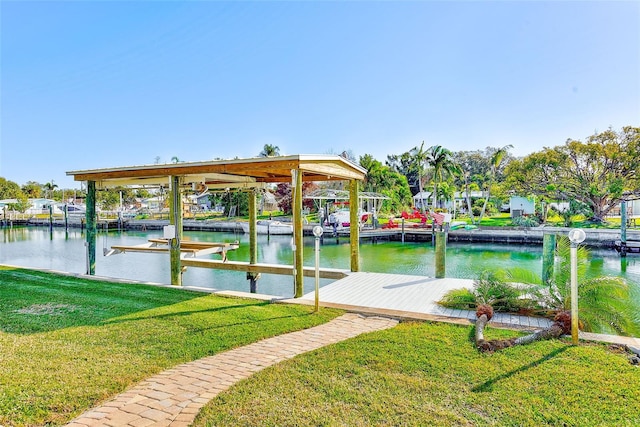 dock area featuring a yard and a water view