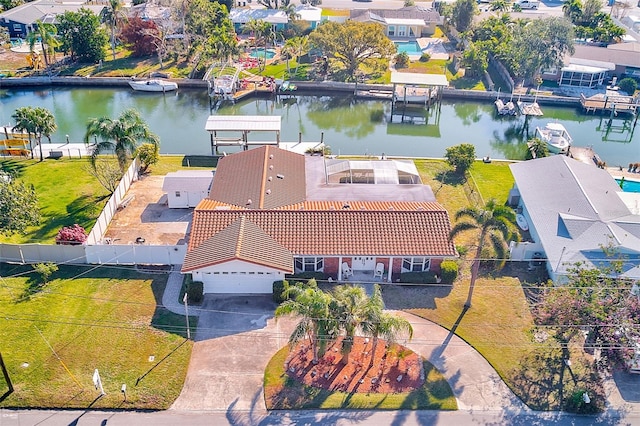 birds eye view of property with a water view