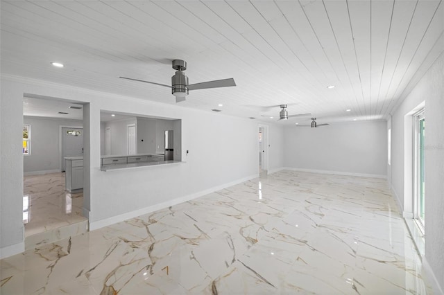 empty room featuring ornamental molding, ceiling fan, and wooden ceiling