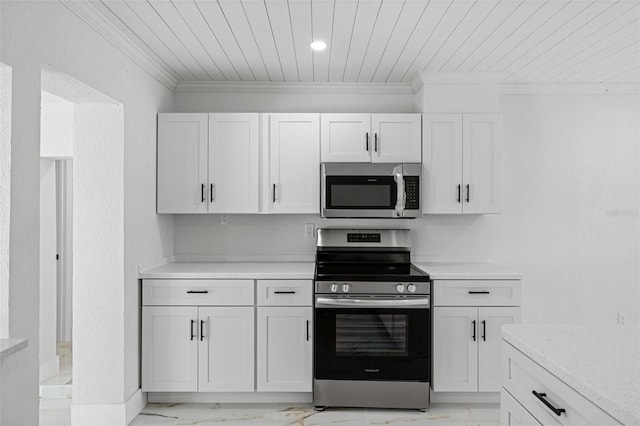 kitchen featuring white cabinetry, ornamental molding, and appliances with stainless steel finishes