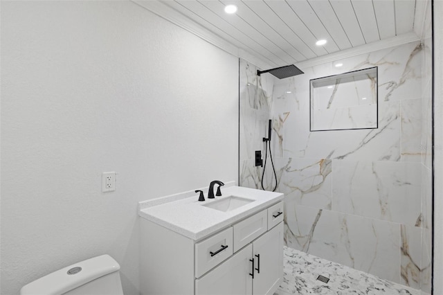 bathroom featuring ornamental molding, vanity, tiled shower, wooden ceiling, and toilet