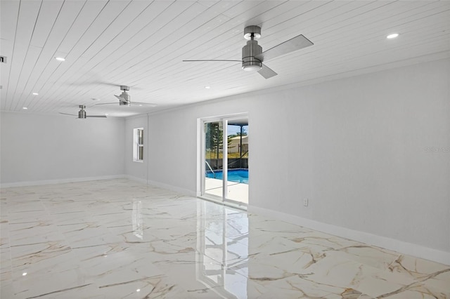 spare room with ceiling fan and wood ceiling