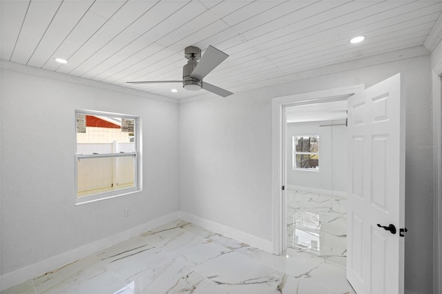 empty room featuring ceiling fan, a healthy amount of sunlight, and wooden ceiling