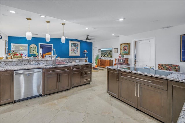 kitchen with light stone countertops, ceiling fan, sink, stainless steel dishwasher, and decorative light fixtures