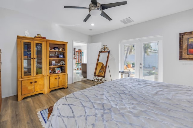 bedroom featuring ceiling fan, access to exterior, light hardwood / wood-style flooring, and french doors