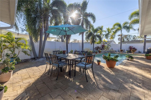 view of patio / terrace with a fenced in pool