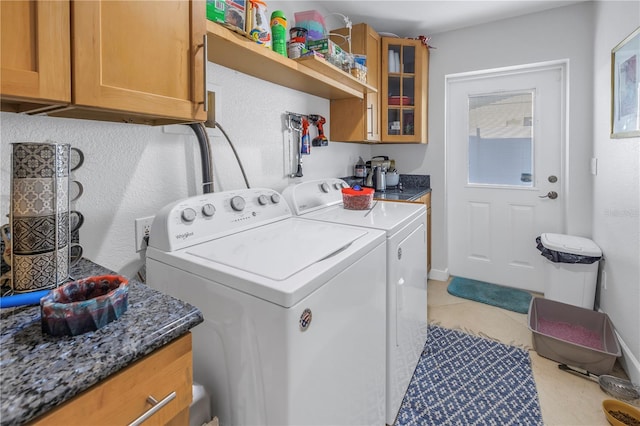 laundry area featuring cabinets and washing machine and dryer