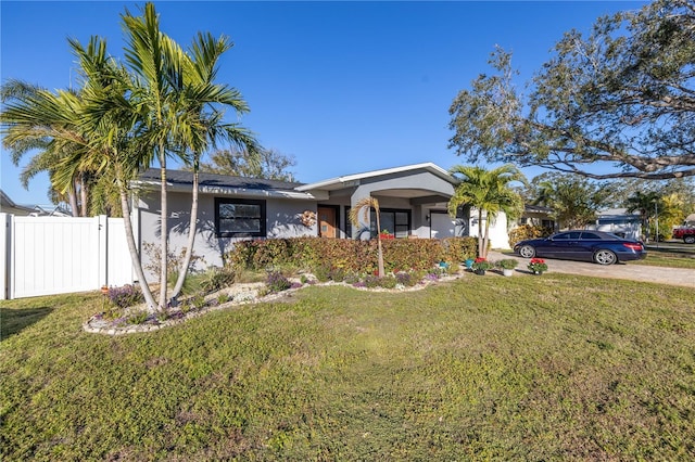 ranch-style house with a front yard