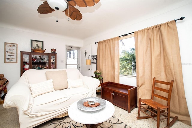 living room with a wealth of natural light and ceiling fan