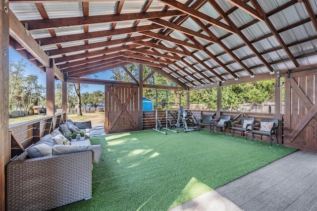 exterior space featuring a storage shed and outdoor lounge area