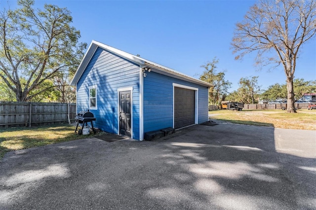 garage with a yard