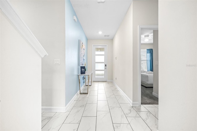 601 Drop Shot Dr, Davenport, FL 33896 - corridor with light marble finish flooring and baseboards