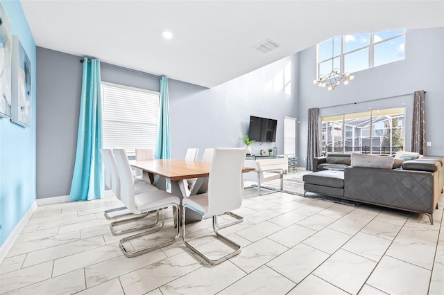 601 Drop Shot Dr, Davenport, FL 33896 - dining room with light marble finish flooring, a chandelier, and recessed lighting