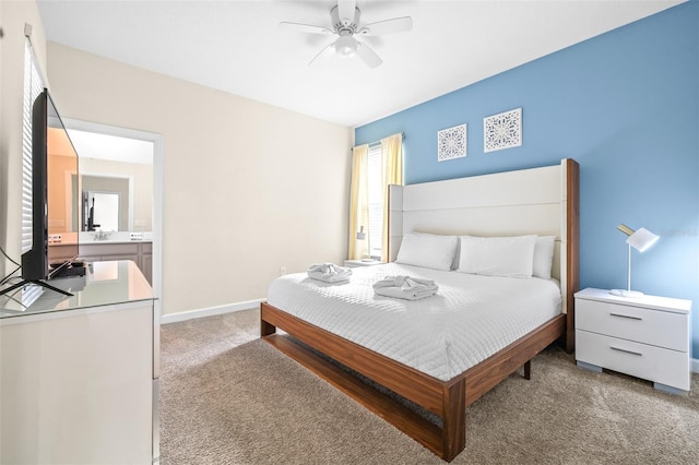 bedroom with ceiling fan and light carpet