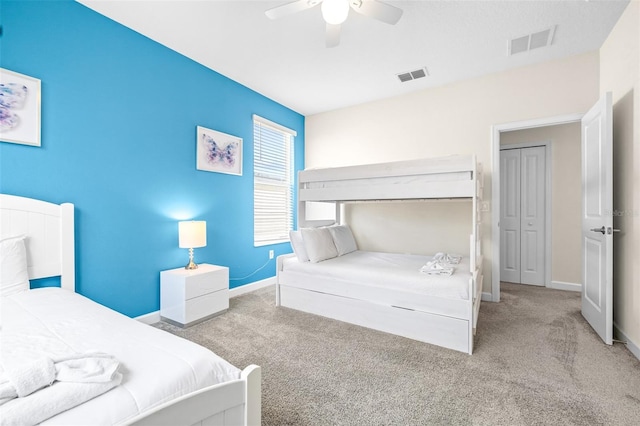 carpeted bedroom with a closet and ceiling fan