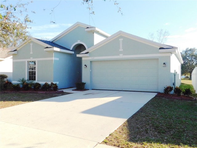 single story home featuring a garage