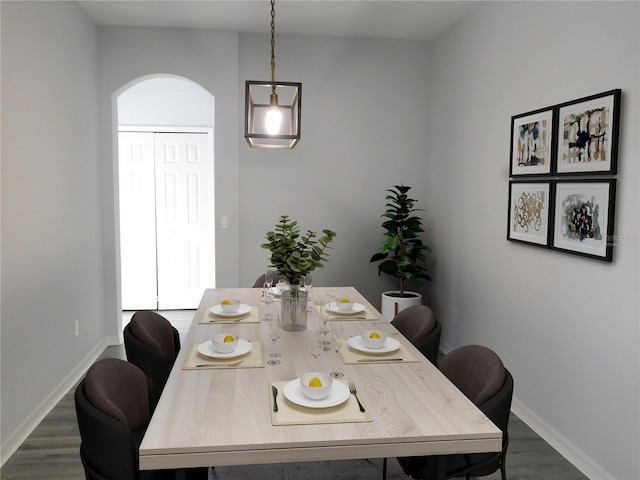 dining area featuring dark hardwood / wood-style flooring