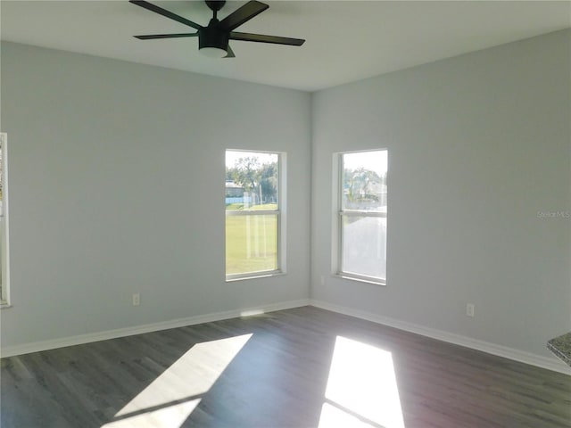 unfurnished room featuring ceiling fan and dark hardwood / wood-style flooring