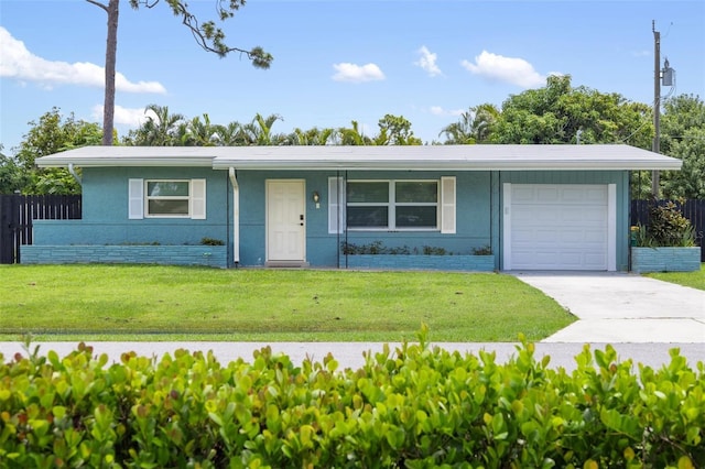 ranch-style home featuring a garage and a front lawn