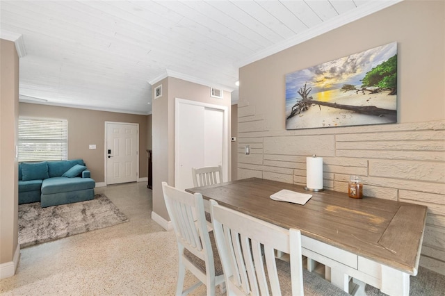 dining room with crown molding and wood ceiling