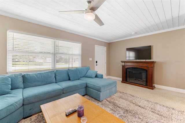 living room with ceiling fan and crown molding