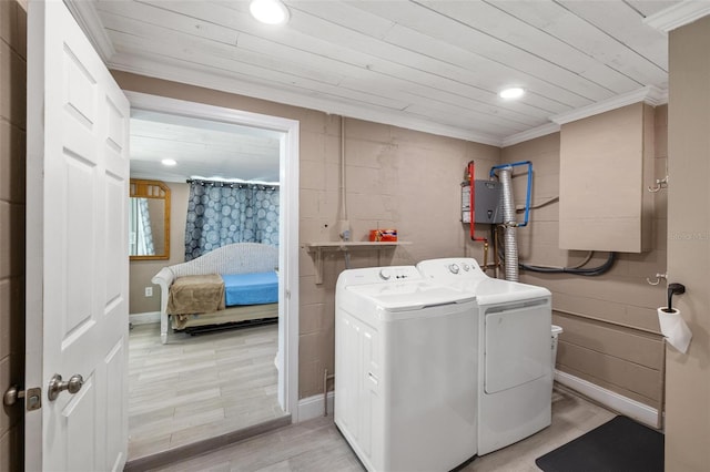 laundry area with ornamental molding, washer and clothes dryer, and wooden ceiling