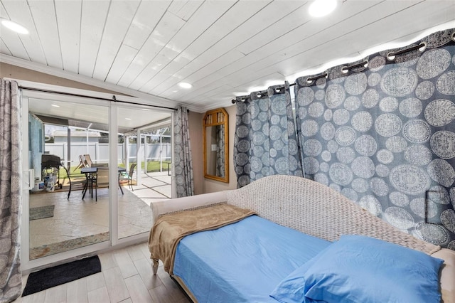 bedroom featuring lofted ceiling and wooden ceiling