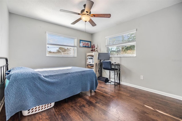 bedroom featuring dark hardwood / wood-style floors and ceiling fan