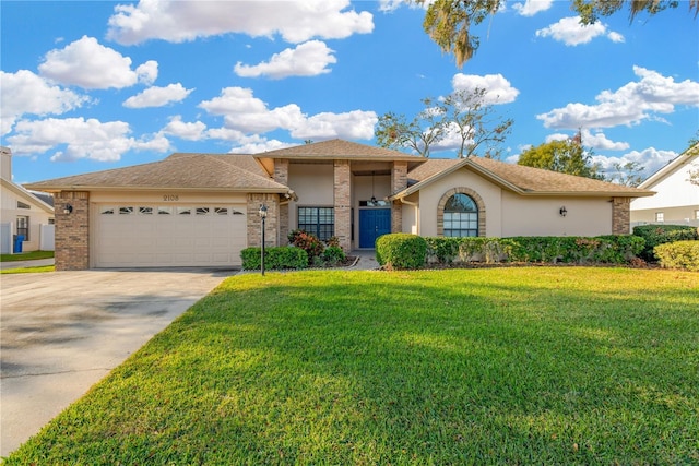 view of front of property featuring a front yard and a garage