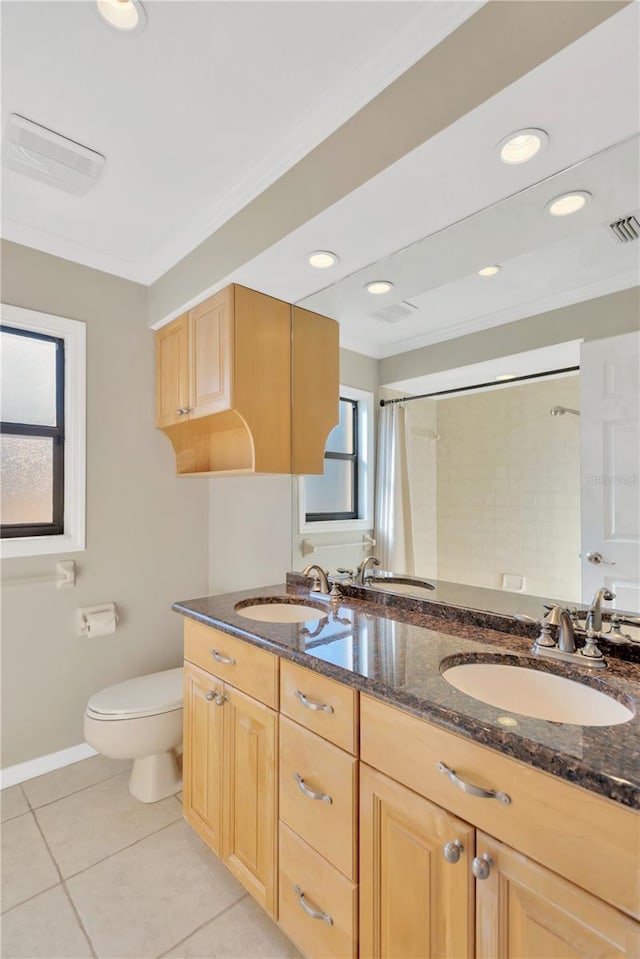 bathroom featuring toilet, tile patterned flooring, ornamental molding, and vanity