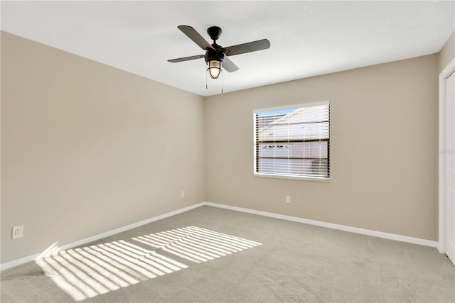 carpeted empty room with ceiling fan