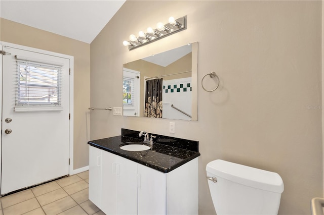 bathroom with toilet, tile patterned flooring, lofted ceiling, a shower with curtain, and vanity