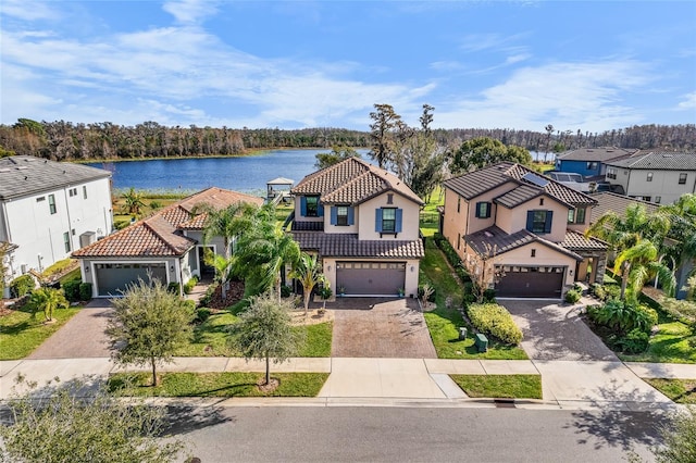 birds eye view of property with a water view