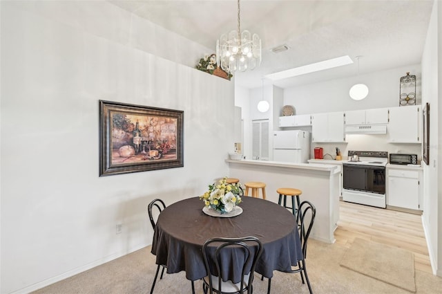 dining area with a chandelier