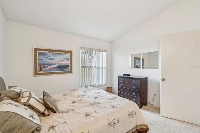 carpeted bedroom featuring vaulted ceiling