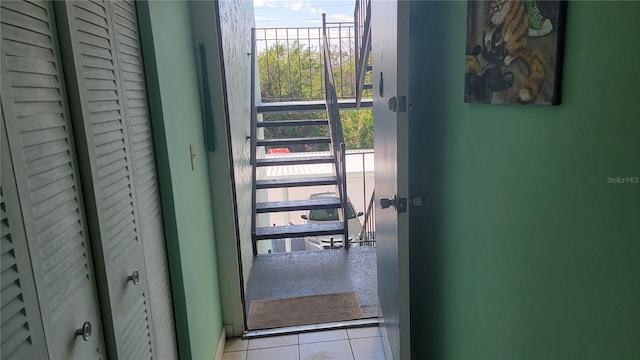 entryway with light tile patterned floors