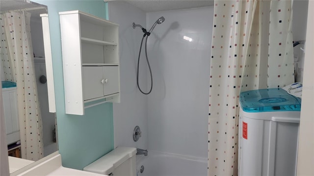 full bathroom with washer / clothes dryer, toilet, vanity, and shower / bath combo