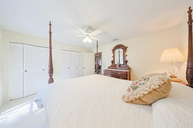 bedroom featuring a textured ceiling and ceiling fan