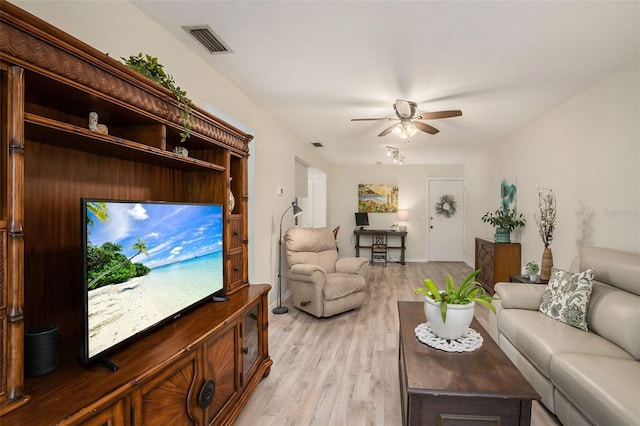 living room with ceiling fan and light hardwood / wood-style floors