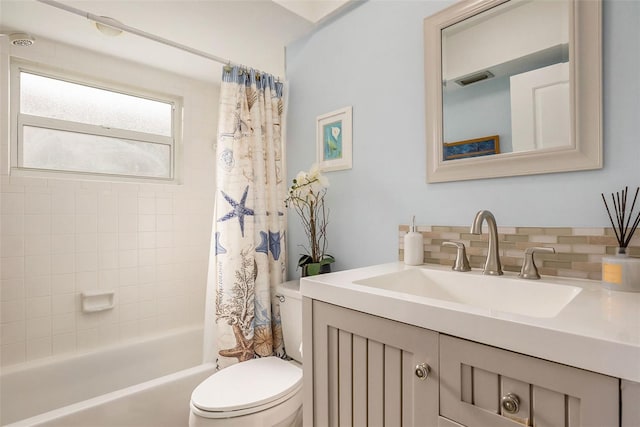 full bathroom with vanity, toilet, and shower / bath combo with shower curtain