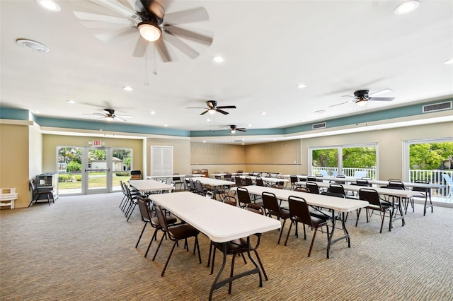 dining area featuring plenty of natural light, carpet floors, and french doors