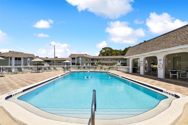 view of pool featuring a patio