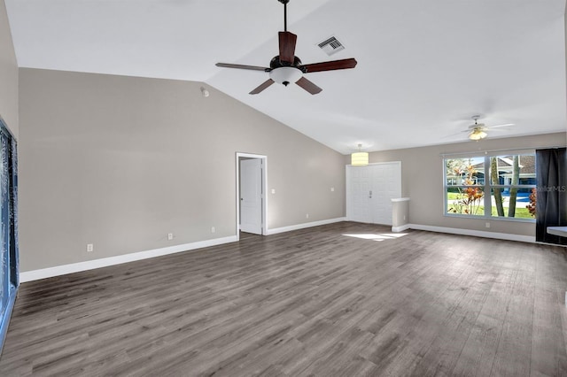 unfurnished living room with dark hardwood / wood-style floors, vaulted ceiling, and ceiling fan