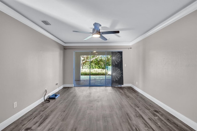 empty room with hardwood / wood-style flooring, ceiling fan, and crown molding