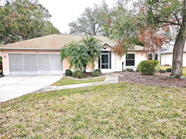 ranch-style house with a front yard and a garage