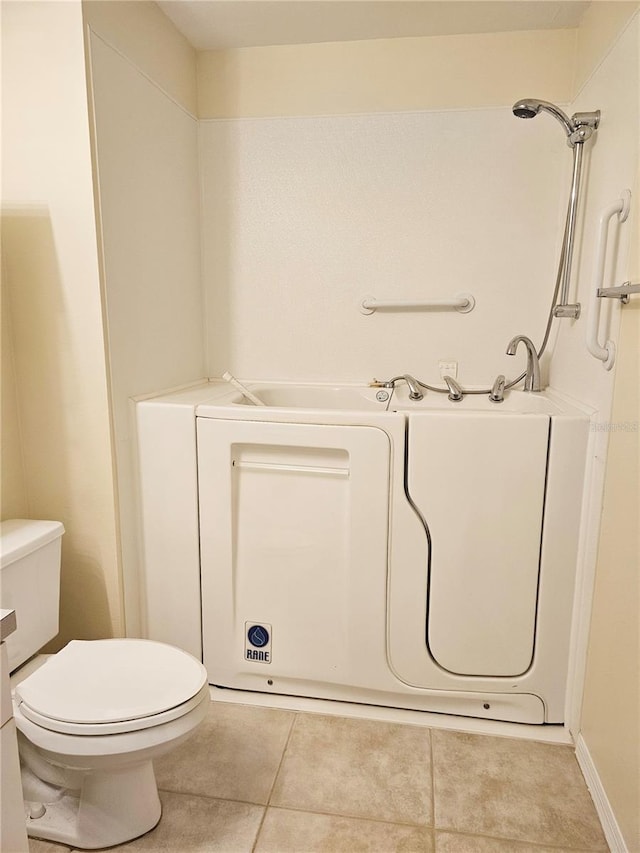 full bath with toilet and tile patterned flooring