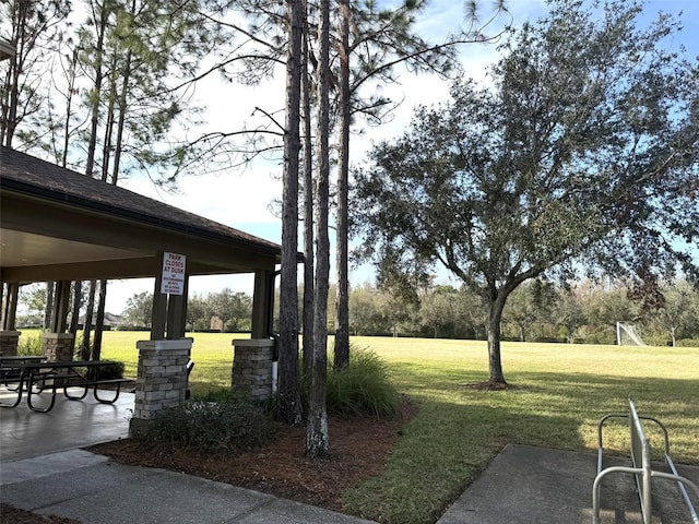 surrounding community featuring a lawn and a gazebo